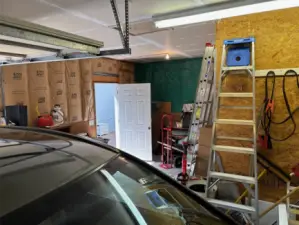 Huge 2 car garage with a shop space.
