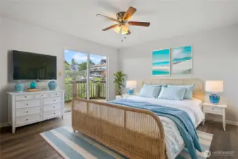 Virtually staged. Primary bedroom with view deck to the NE. Bay and mountain views and sunrises...