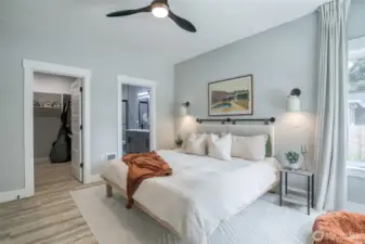 Primary suite with walk-in closet and private 3/4 bath