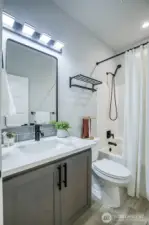 Main full bath with black fixtures