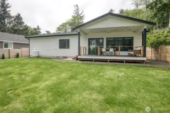 Large, level, fully fenced backyard