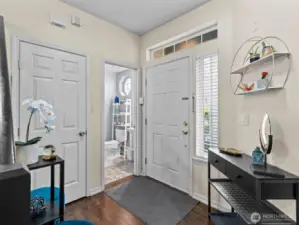 An open and airy foyer give plenty of room for shoe storage.
