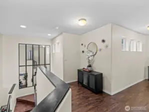 Once upstairs, the thoughtfully designed hallways have space for furniture, creating a cozy feeling.