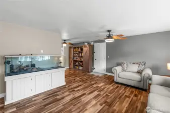 MAIN FLOOR | Another view of the living room, the door to the garage and the fabulous pantry unit that stays with the home.