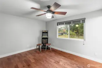 UPPER LEVEL | The primary bedroom is located on the upper level at the end of the hall on the right and overlooks the backyard.