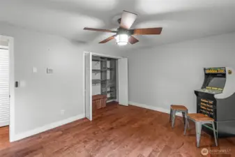 UPPER LEVEL | Another view of the primary bedroom. You'll appreciate the closet system and functional ceiling fan.