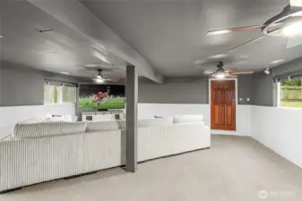 LOWER LEVEL | This huge rec room is perfect for large gatherings! With a door that leads to the backyard and lots of windows to let in light, this is a room you'll want to live in.