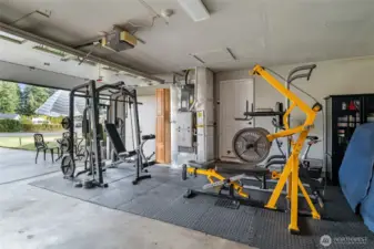 MAIN FLOOR | The current owner has a full gym set up in one half of the garage and parking in the other half.