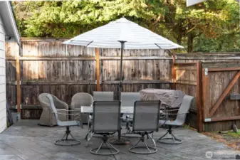 BACKYARD | Here's one of the areas for a patio table just inside the gate to the side yard.