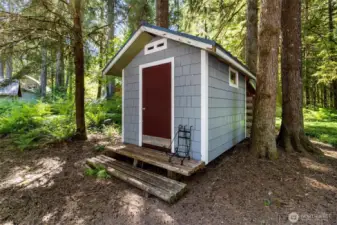Handy outdoor storage shed for tools, skis, and adventure gear.