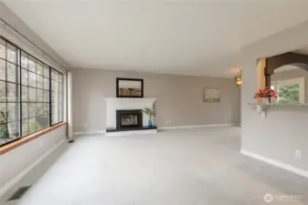 Bright living room on the main level with an elegant gas fireplace