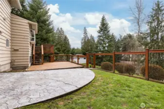 Patio/deck area is fully-fenced