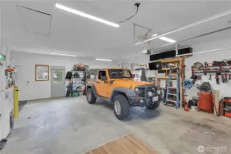 2 car garage equipped with 2 tank-less water heaters and energy efficient gas heating.