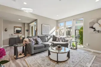 The living room is cozy yet spacious, with fantastic southern exposure filling the space with light any time of year.