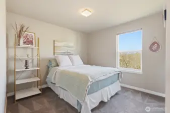 One of two additional upstairs bedrooms with great morning light.