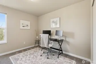 Third upstairs bedroom, staged as an office.