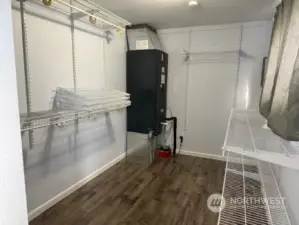 Primary bedroom walk in closet.