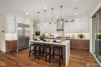 JennAir appliances, including a built-in refrigerator, 5 burner gas range and convection microwave oven