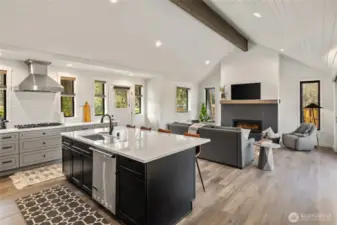 Beautiful Great Room design with vaulted T&G ceilings and stained beam