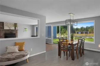 Open dining room with views of backyard & pastures