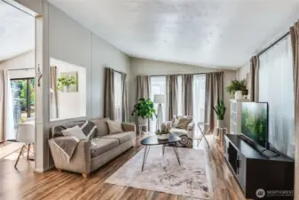 Open-concept layout with vaulted ceilings between living and dining areas—great for everyday comfort or entertaining.