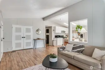 Bright and open living room with NEW laminate flooring and a modern layout.