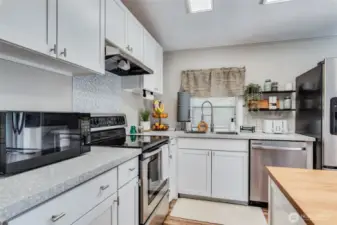 Create your favorite recipes using the new glass SS cooktop stove and new vent hood.