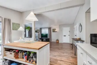 Open concept, complete w/NEW laminate flooring, provides the perfect space for entertaining and everyday living.