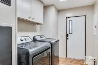 Well appointed laundry area with back entry—perfect for everyday convenience.