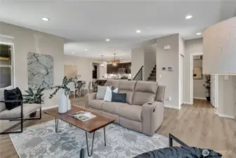 Open concept living leads into the eating area and kitchen.