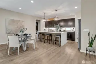 Waterfall quartz center island offers ample space for cooking and baking.