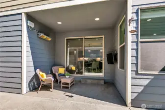 Covered patio has been extended to include a large area for cooking and entertaining.