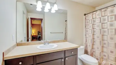 The primary bath has a combination shower and tub.