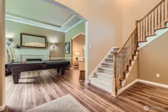 Soaring entry with beautiful laminate hardwood floors that flow throughout the main living areas.