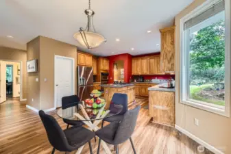 Windows off the casual dining area let the outdoors in.