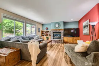 The family room with a cozy fireplace invites relaxation.