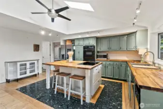Updated kitchen with updated appliances.  Double ovens, beautiful refrigerator, wine rerigerator.