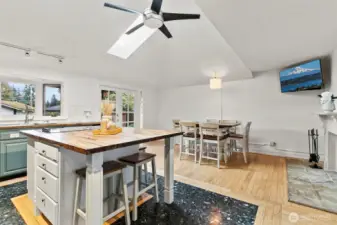 The kitchen is more of a kitchen/dining/family area with wood burning fireplace.  Big vaulted ceilings and french doors out to the beautiful covered back patio.