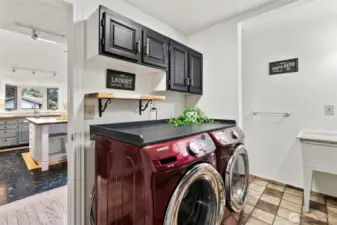 Laundry room right off the kitchen with a door out to the garage.  There is a 1/2 bath in here also.