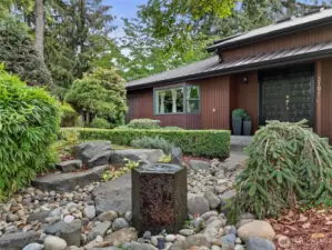 The front of the house, low maintenance and even has this wonderful water feature.