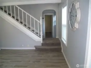 Living room leading to main floor bedroom