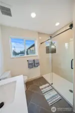 Primary Bath with Custom Shower and tile surround and floor