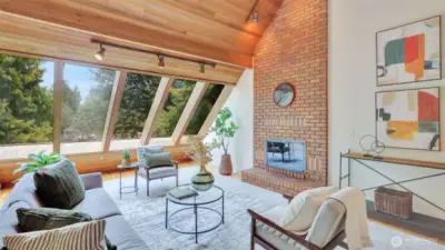 Enjoy tranquil views and the warmth of an eye-catching floor to ceiling brick wall fireplace, creating comfort in every season.