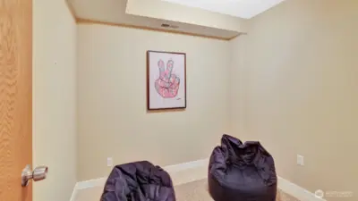 Cozy flex space on the lower-level us ideal for a home office, reading nook, play space, or creative corner.