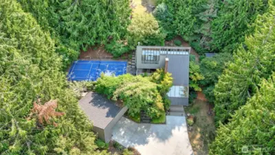 Aerial view showcase this exceptional property with a private pickleball court.