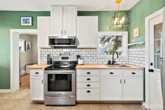 Modern design! Tasteful fixtures! Butcher block countertops!