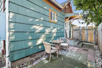 Patio on the side of the house. Room for more furniture and a bbq!