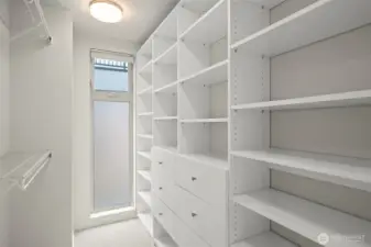 Walk-in closet with floor-to-ceiling window for natural light