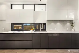 36" induction cooktop with 5 cooking zones, designer vent hood with led lighting, pot filler at cooktop & deep dual sink make prep a breeze