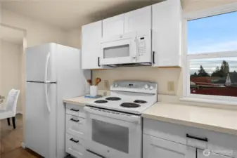 Kitchen view into the dining room.  All appliances stay!